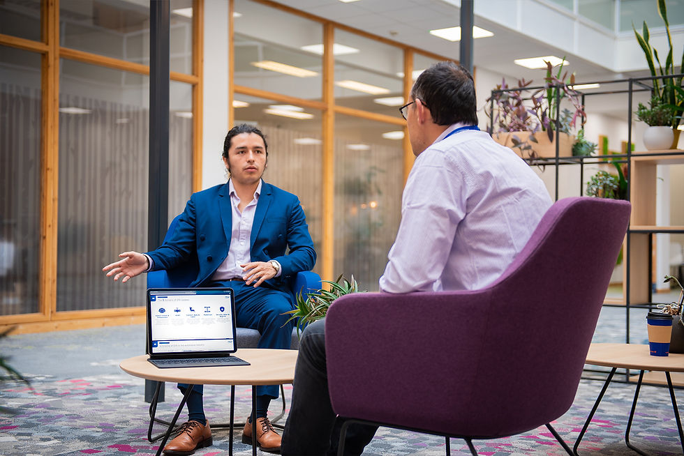 Alessio Ballatore and Edward Paez, automotive consultants talking